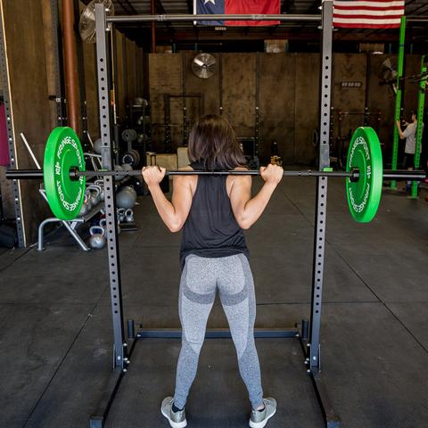 image of a woman using a squat rack